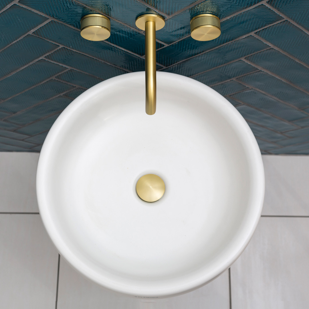 Plan view of 3 hole decca basin mixer wall mounted in gold.