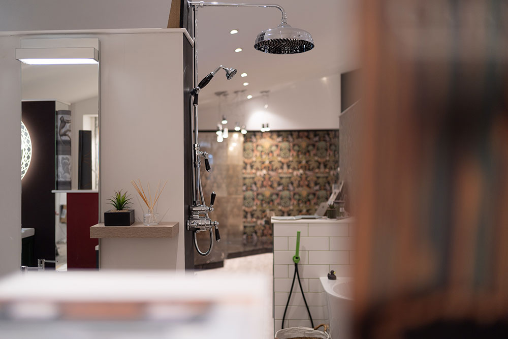 Blurred close of showroom with shower display in background.